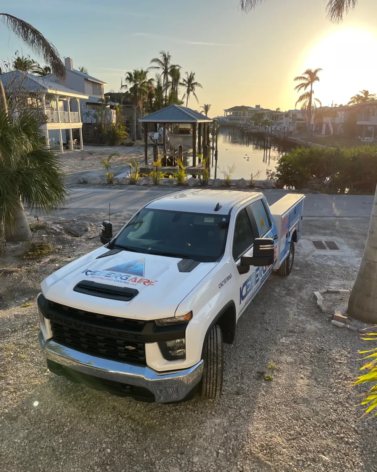 Iceberg Aire service truck at a Southwest Florida waterfront at sunset